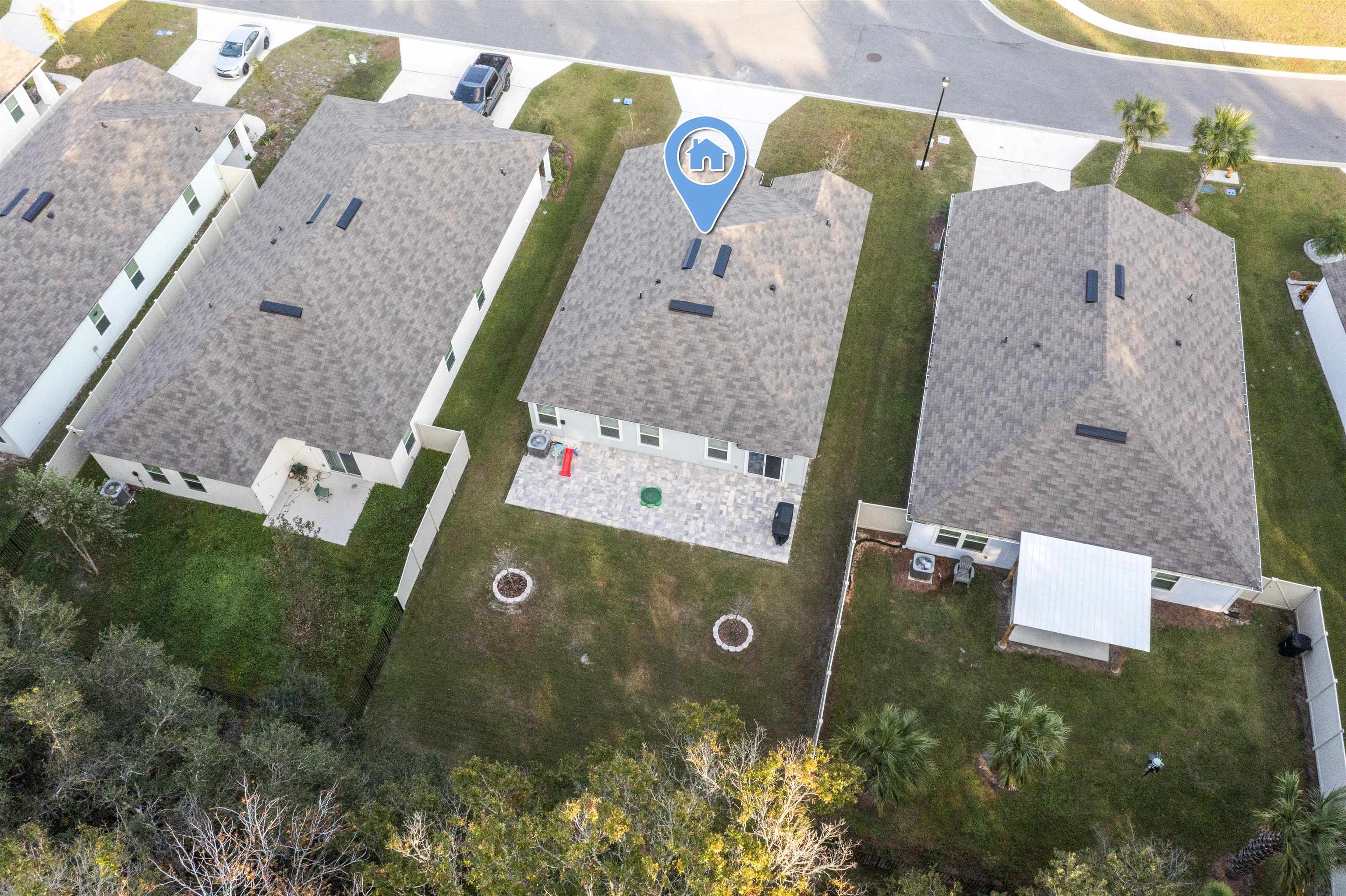 127 Encanto Way St. Augustine, FL 32084 - Photo 32 of 43 an aerial view of a house with a yard and a large pool