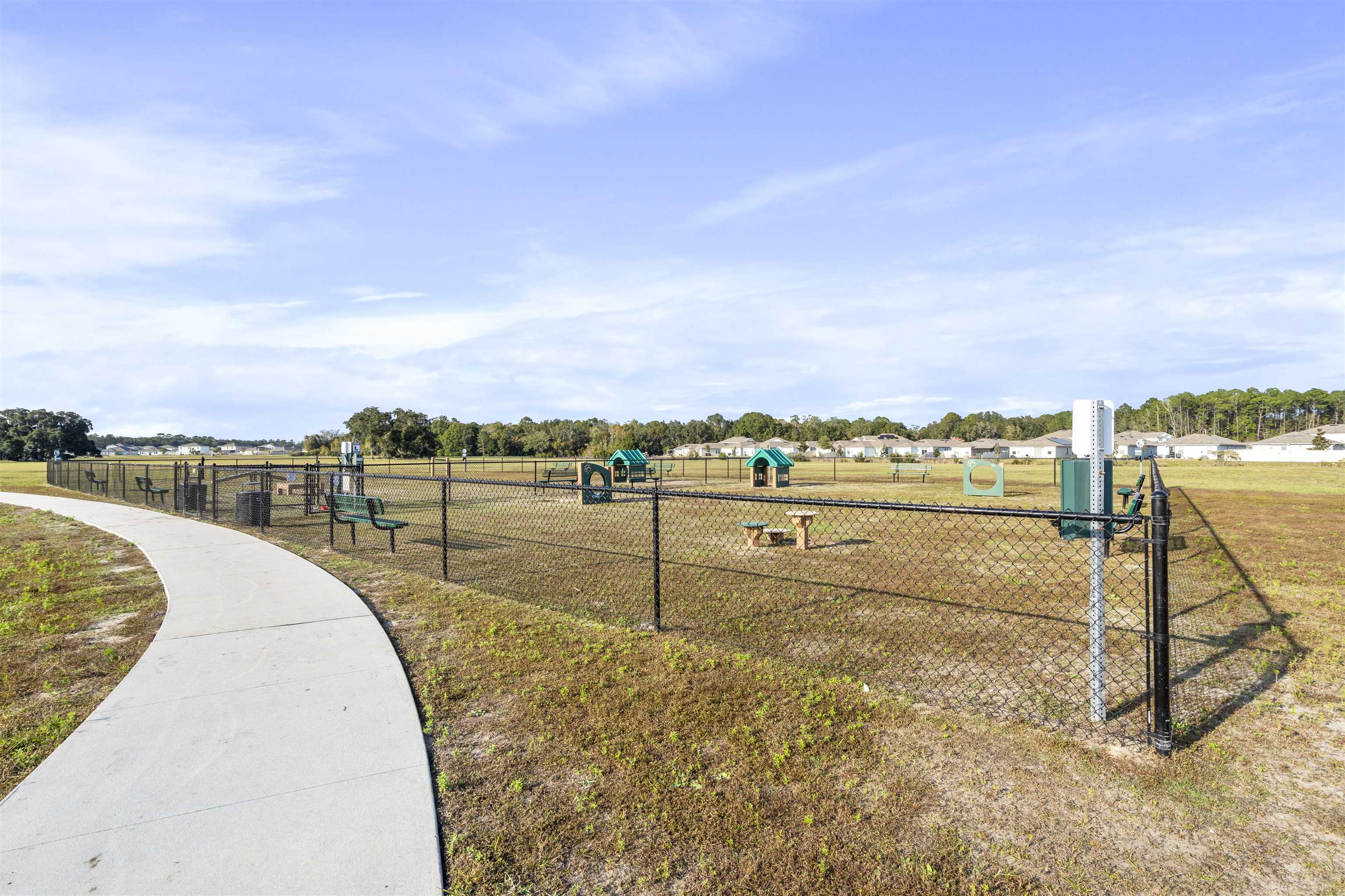 127 Encanto Way St. Augustine, FL 32084 - Photo 41 of 43 a view of a swimming pool with a lawn chairs