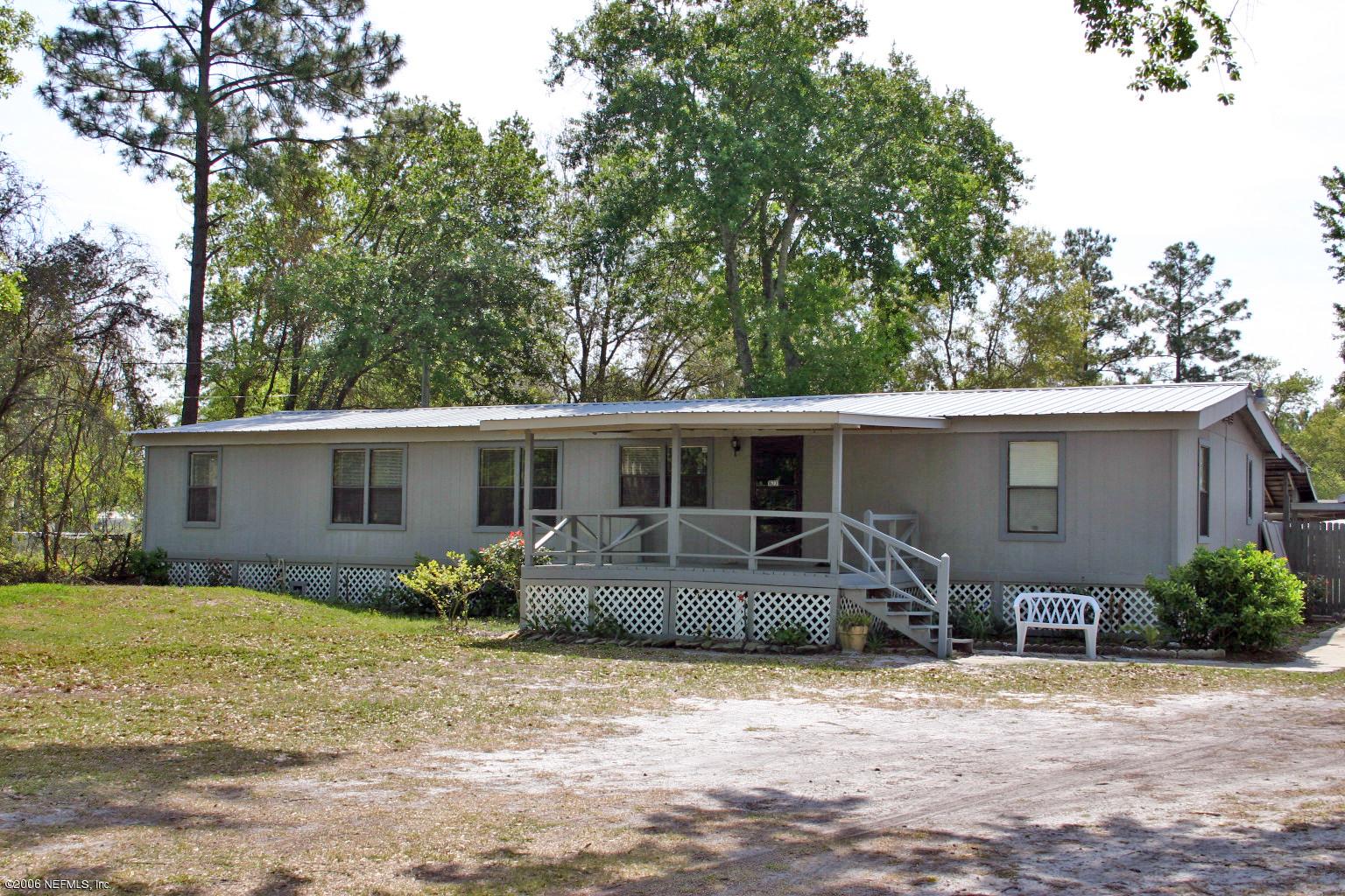 16231 Shark Road West Jacksonville, FL 32226 - Photo 1 of 10 a view of a house with backyard space and garden