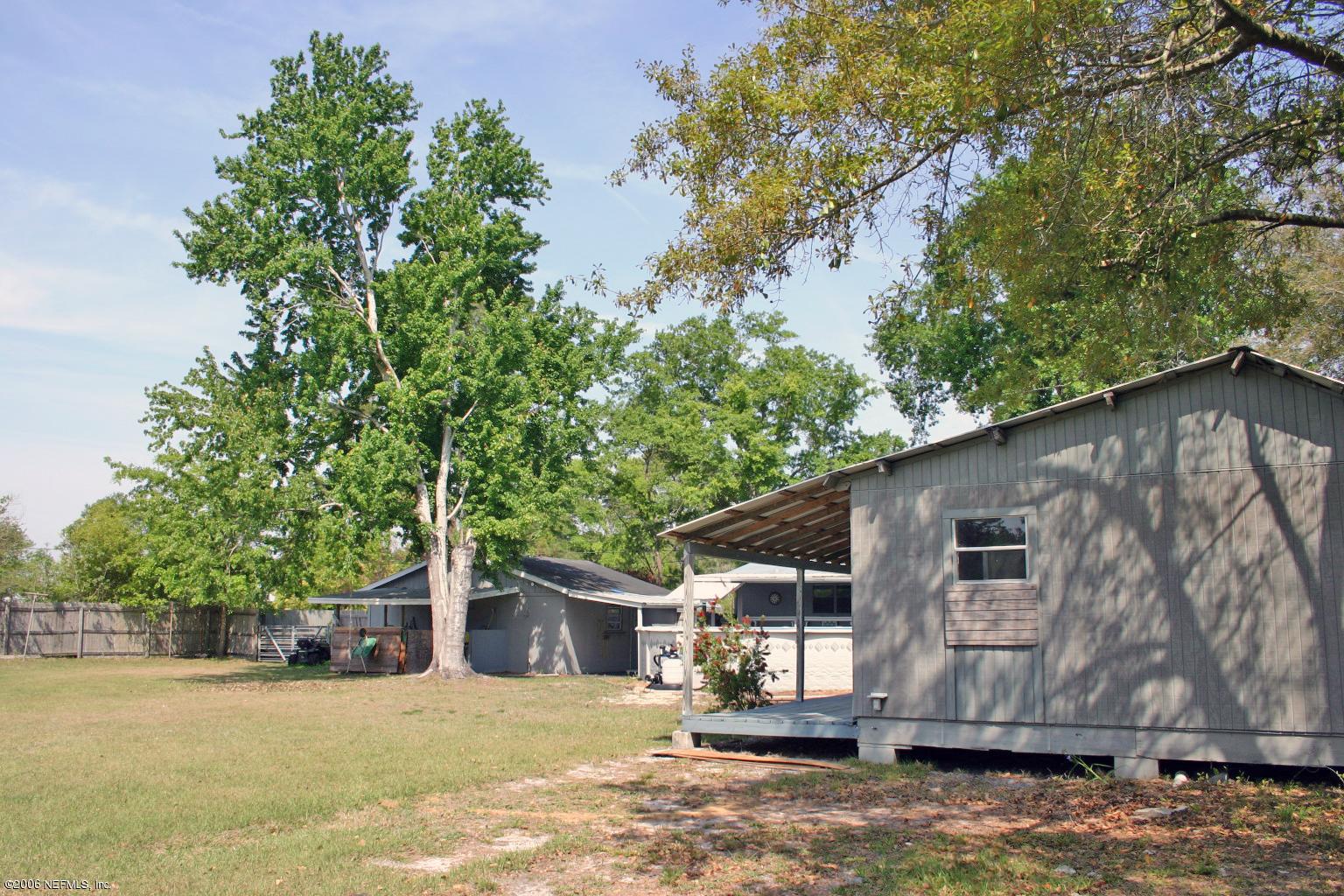 16231 Shark Road West Jacksonville, FL 32226 - Photo 5 of 10 a view of a house with a yard