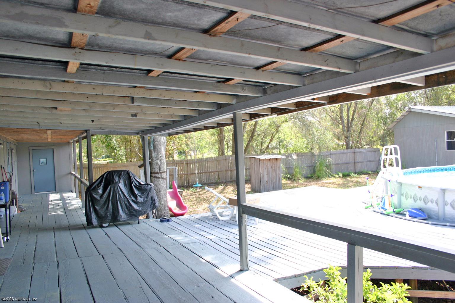 16231 Shark Road West Jacksonville, FL 32226 - Photo 8 of 10 a view of porch with wooden floor