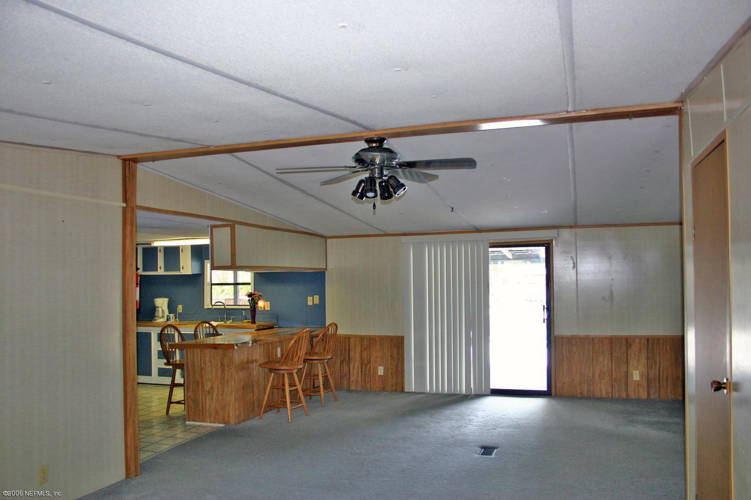 16231 Shark Road West Jacksonville, FL 32226 - Photo 9 of 10 a view of a livingroom with furniture and windows