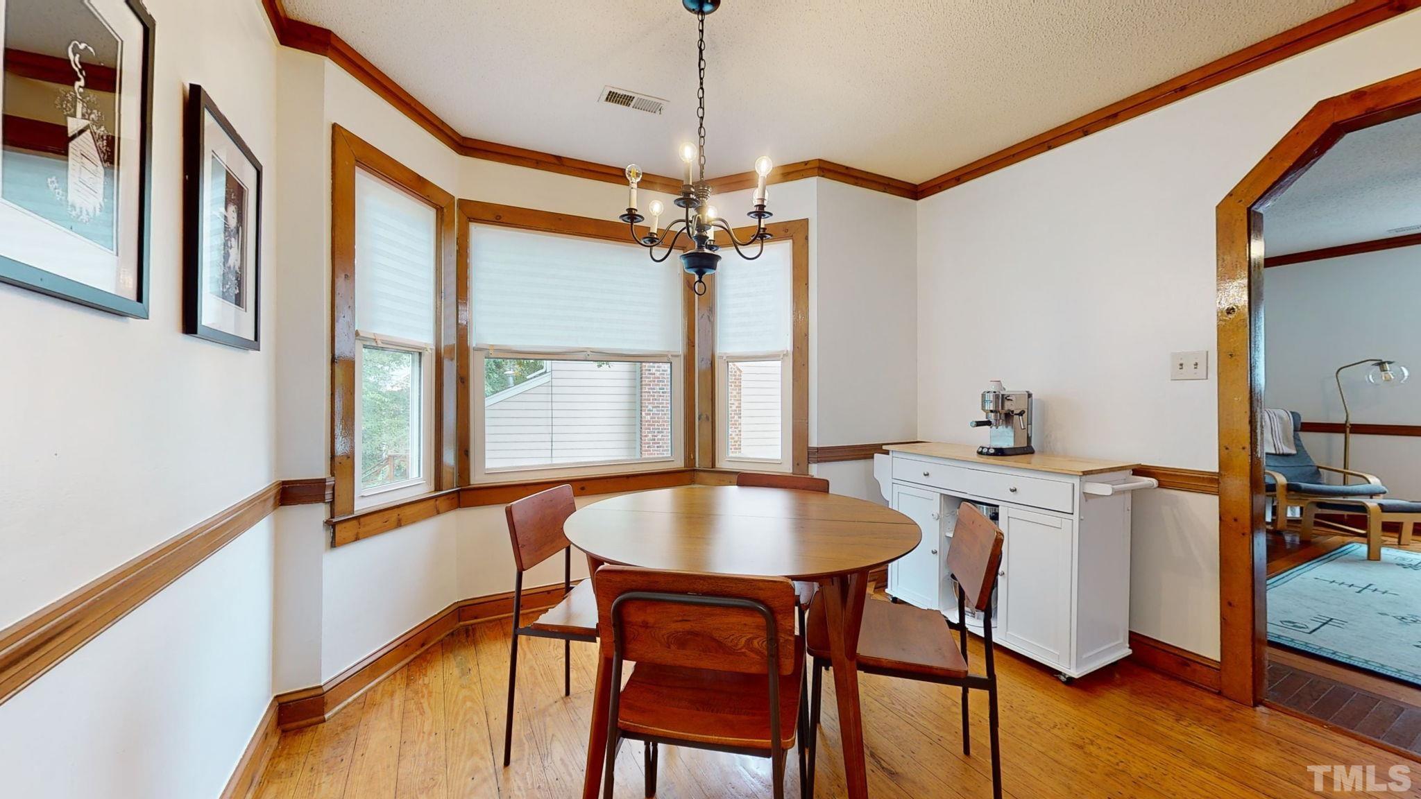 3308 Gatcombe Place Raleigh, NC 27604 - Photo 11 of 43 a dining room with furniture window and wooden floor