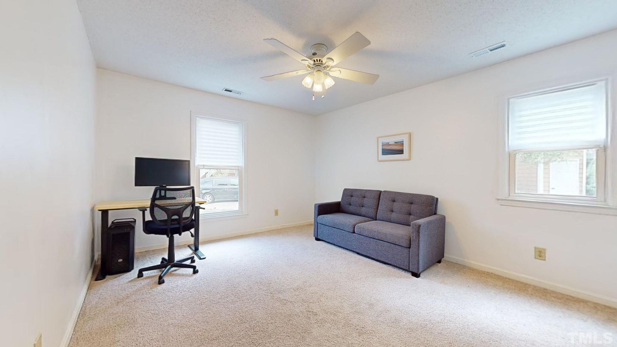 3308 Gatcombe Place Raleigh, NC 27604 - Photo 17 of 43 a view of a livingroom with workspace and a window