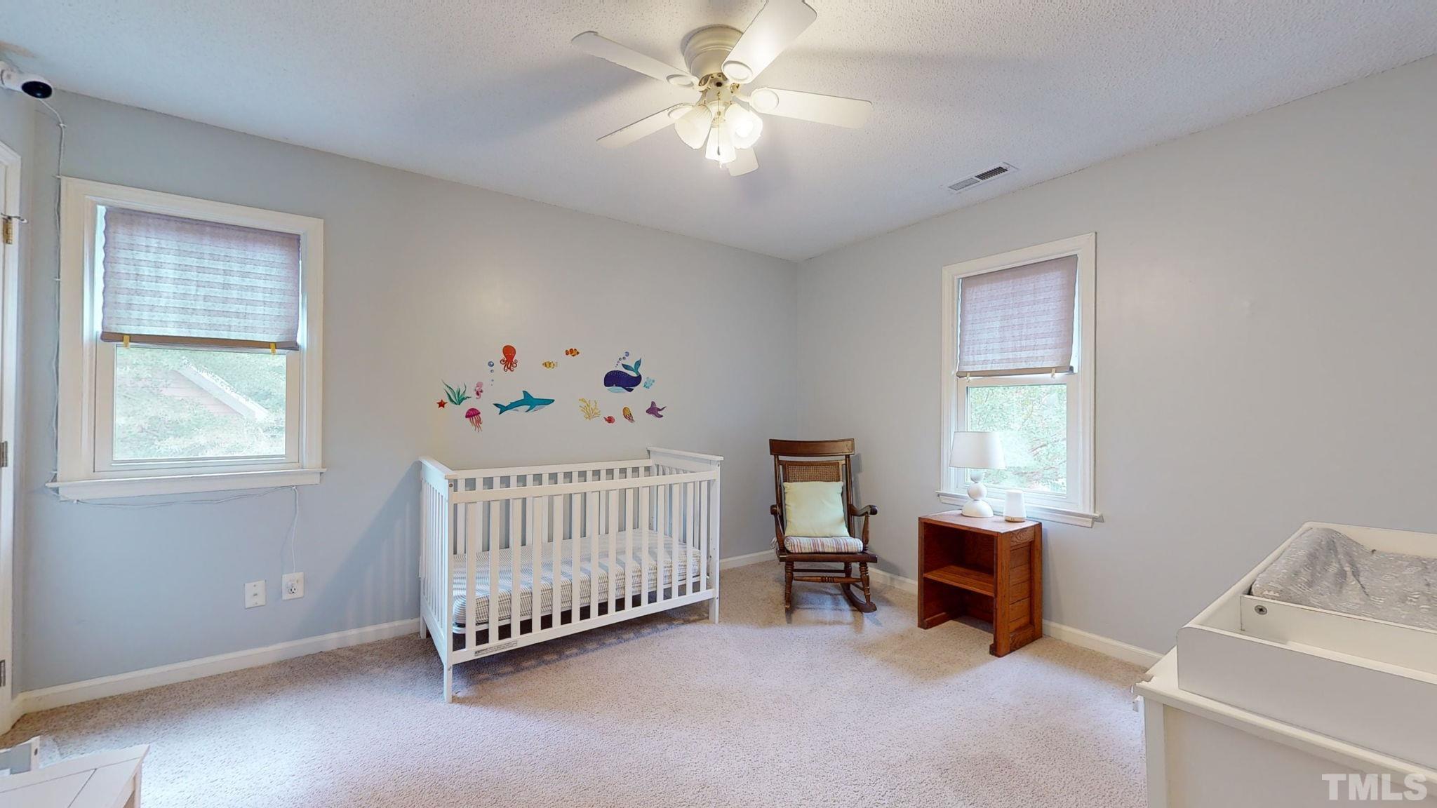 3308 Gatcombe Place Raleigh, NC 27604 - Photo 22 of 43 a bedroom with furniture and window