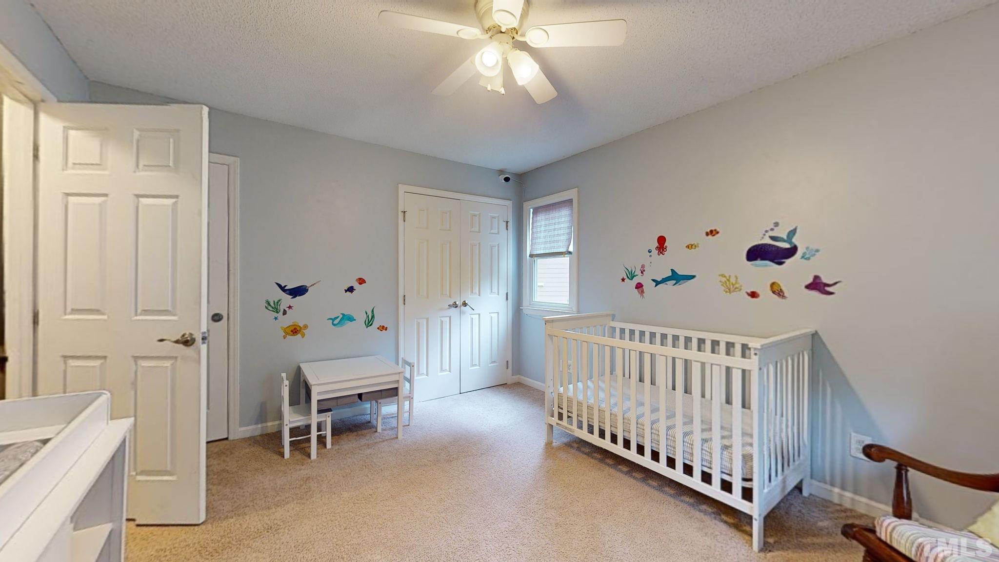 3308 Gatcombe Place Raleigh, NC 27604 - Photo 23 of 43 a bedroom with furniture and a window