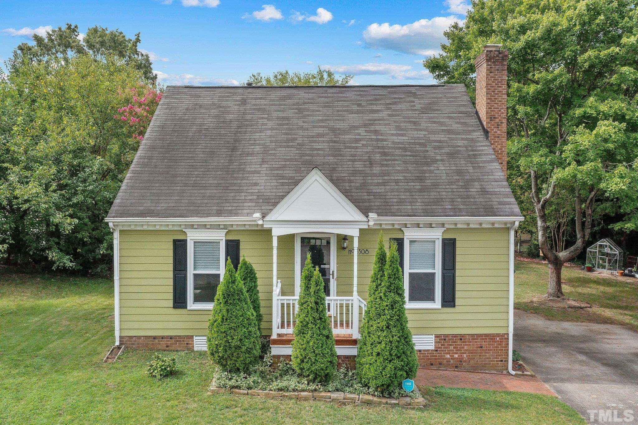 3308 Gatcombe Place Raleigh, NC 27604 - Photo 29 of 43 a front view of a house with garden