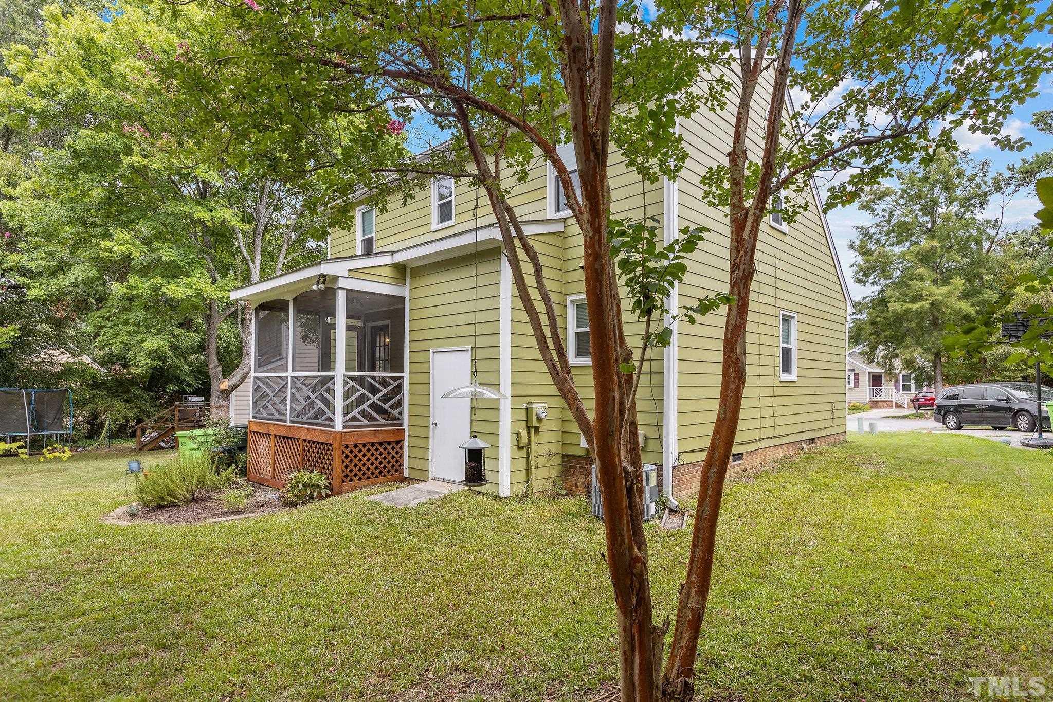 3308 Gatcombe Place Raleigh, NC 27604 - Photo 39 of 43 a backyard of a house with barbeque oven table and chairs