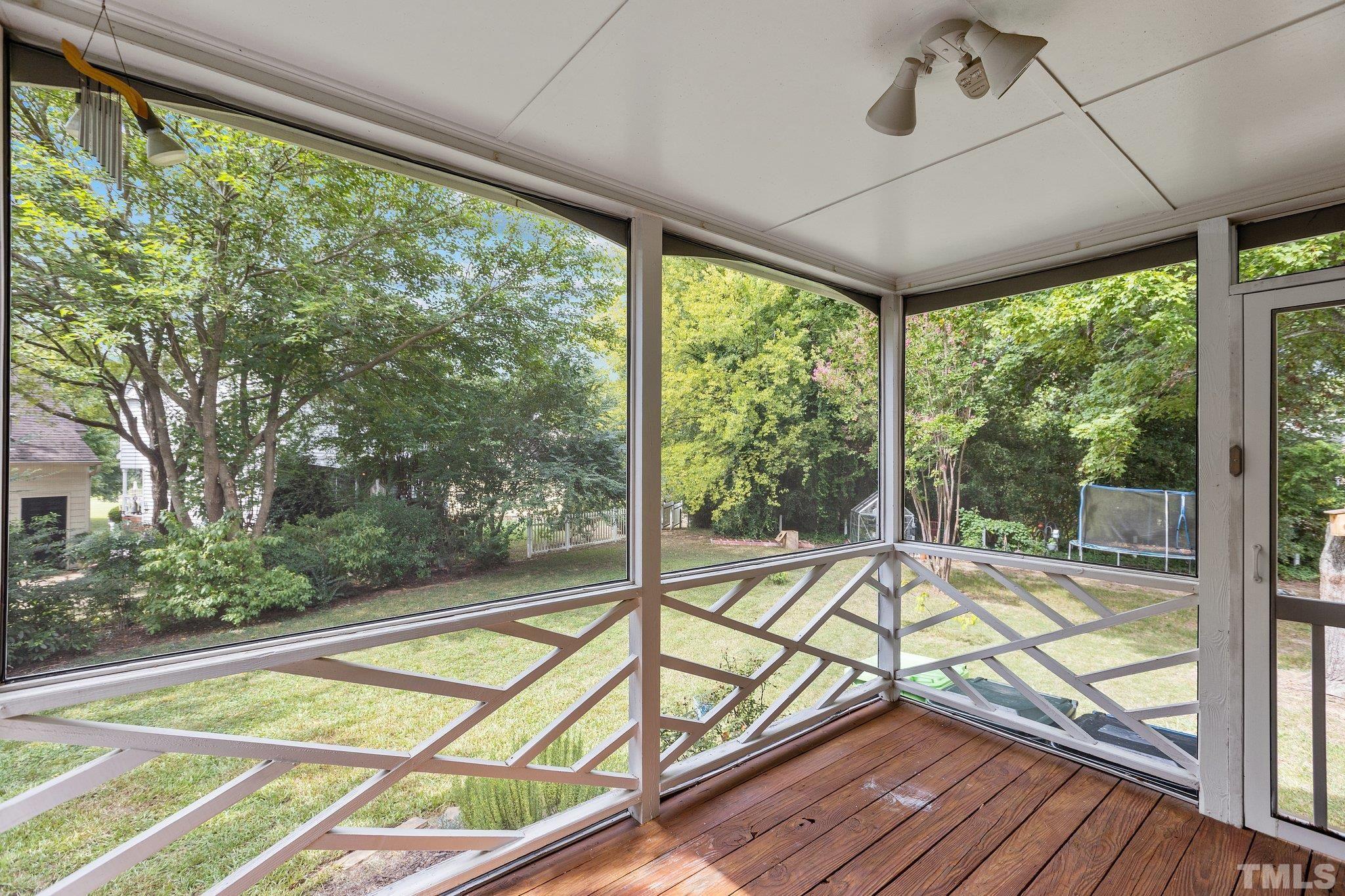 3308 Gatcombe Place Raleigh, NC 27604 - Photo 43 of 43 a view of a balcony with floor to ceiling windows with wooden floor