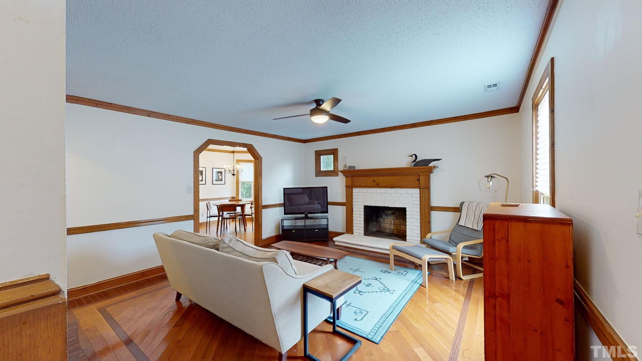 3308 Gatcombe Place Raleigh, NC 27604 - Photo 5 of 43 a living room with fireplace furniture and a large window