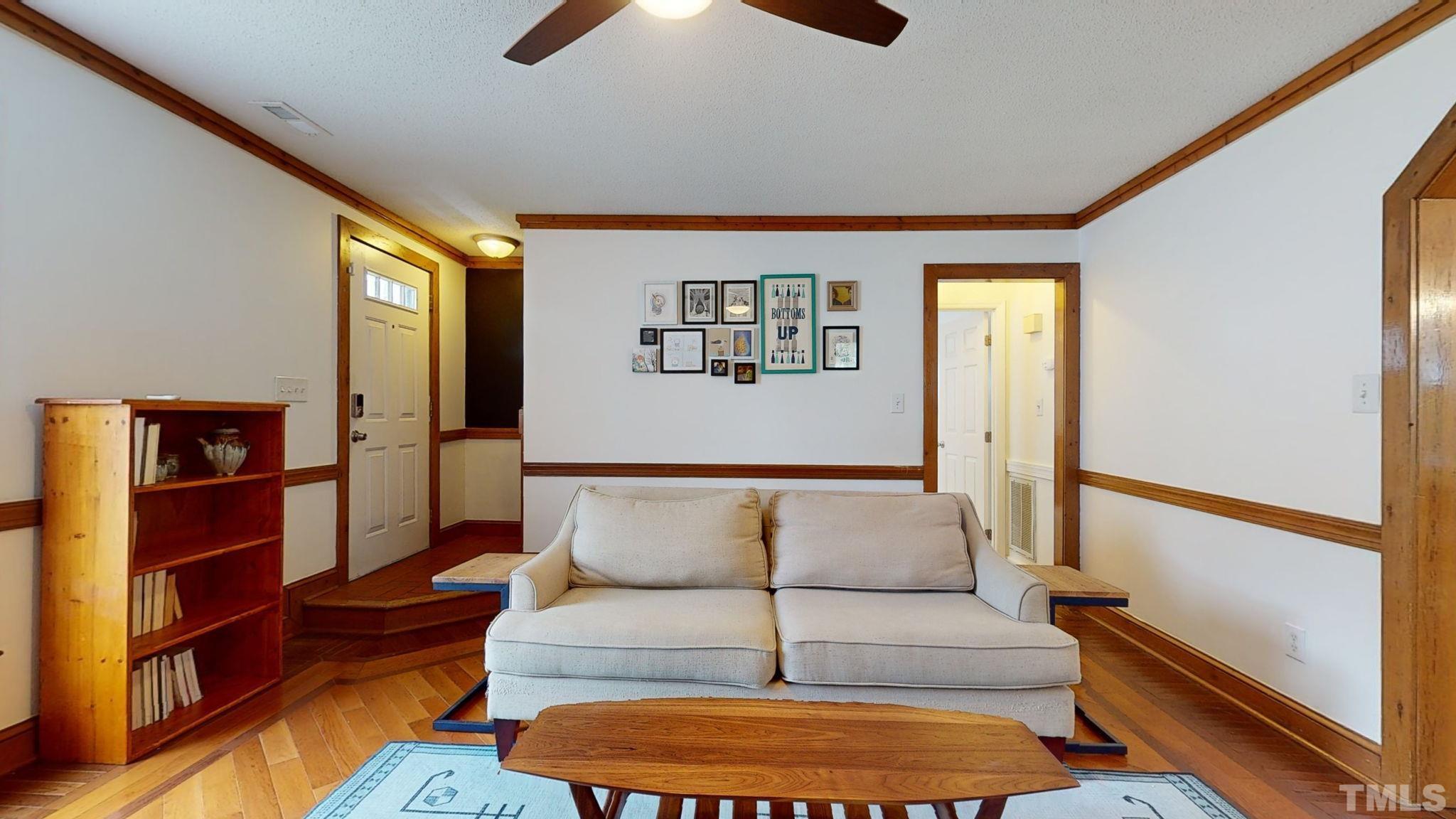 3308 Gatcombe Place Raleigh, NC 27604 - Photo 8 of 43 a living room with furniture and a rug