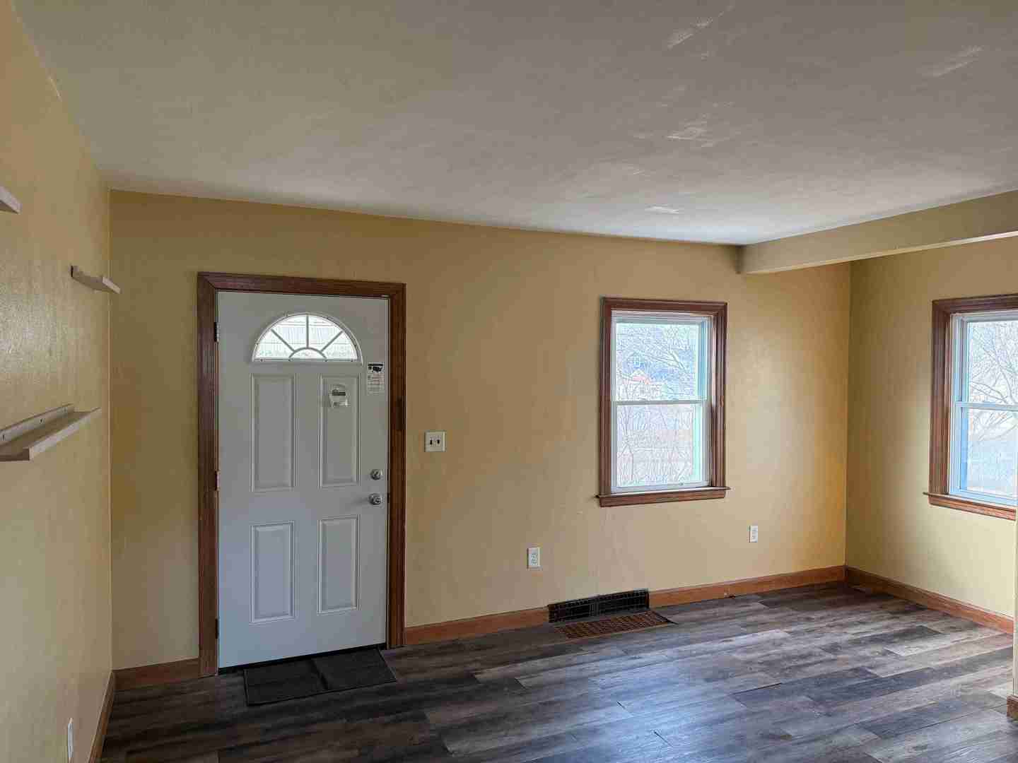 3105-9 9 1/2 Street Rock Island, IL 61201 - Photo 13 of 13 an empty room with wooden floor and windows