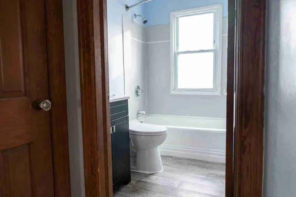 a bathroom with a bathtub sink and toilet