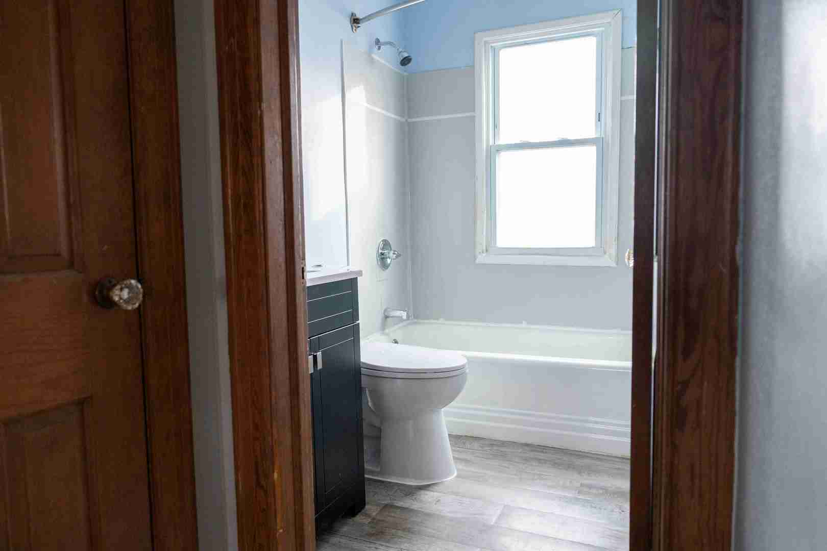 3105-9 9 1/2 Street Rock Island, IL 61201 - Photo 8 of 13 a bathroom with a bathtub sink and toilet