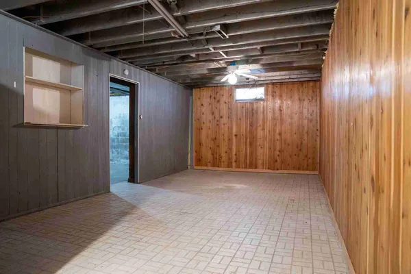a view of an empty room with a closet