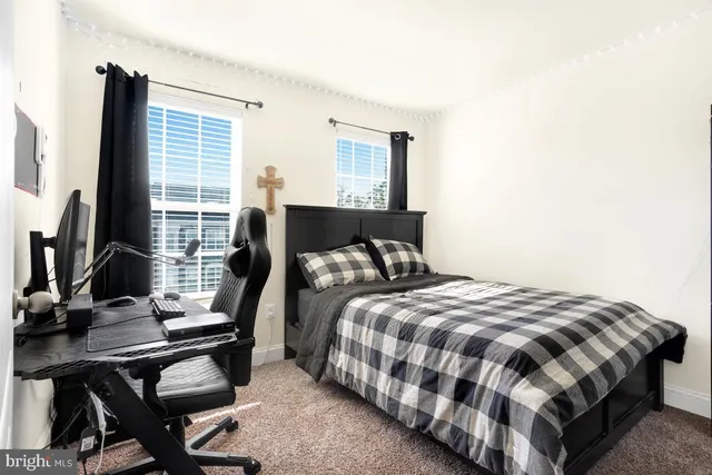 a bedroom with bed and a window