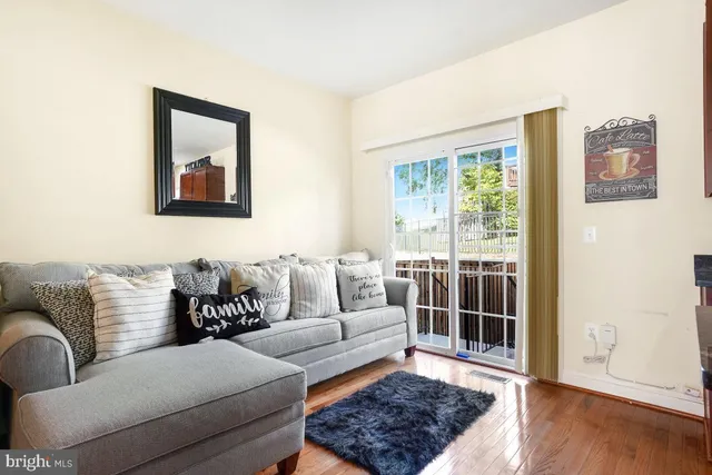 a living room with furniture and a rug