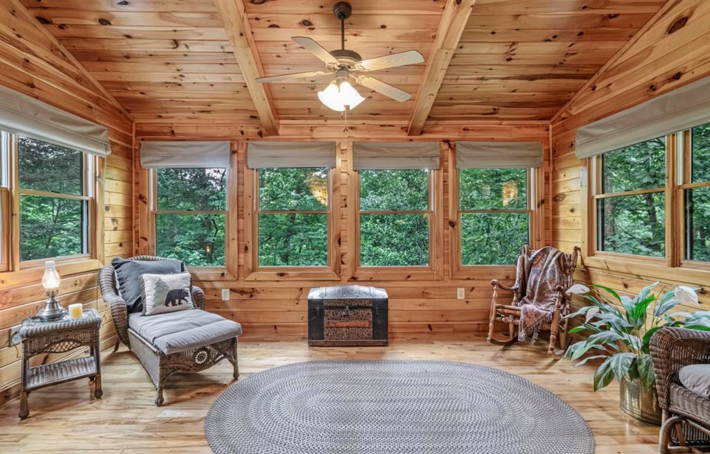 115 Lakota Trail Blue Ridge, GA 30513 - Photo 23 of 49 a living room with patio furniture and floor to ceiling windows