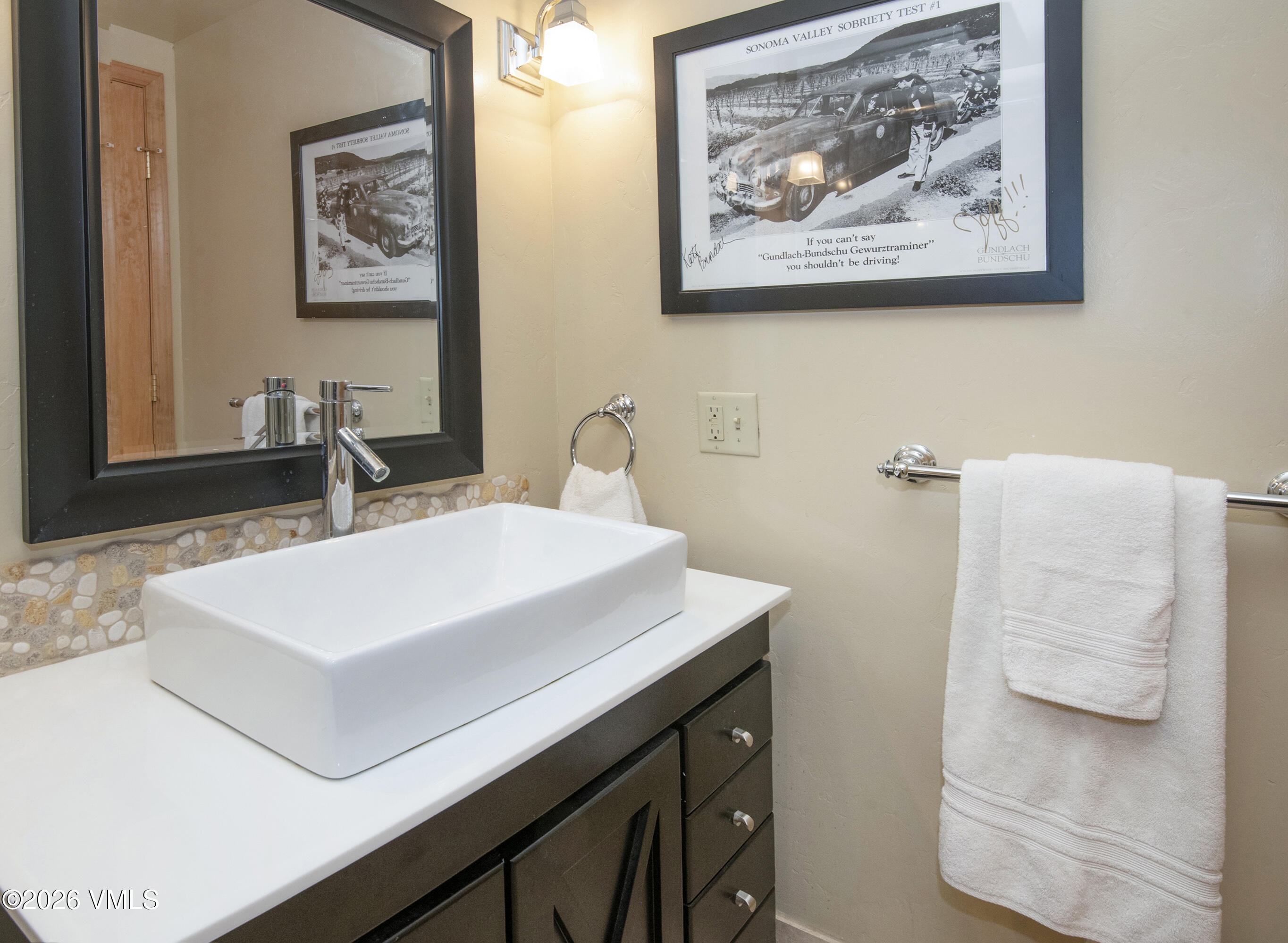 1650 Fall Ridge Road, Unit 202 Vail, CO 81657 - Photo 11 of 32 a bathroom with a sink and a mirror