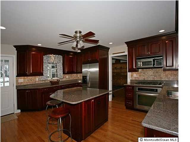 8 Blossom Road Rumson, NJ 07760 - Photo 3 of 3 a kitchen with stainless steel appliances granite countertop a sink stove and refrigerator