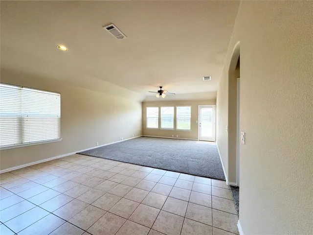 a view of hallway with windows
