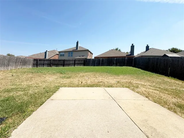 a view of swimming pool with a yard