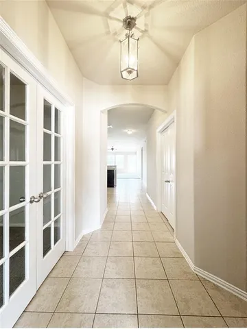 a hallway with a black white checkered floor