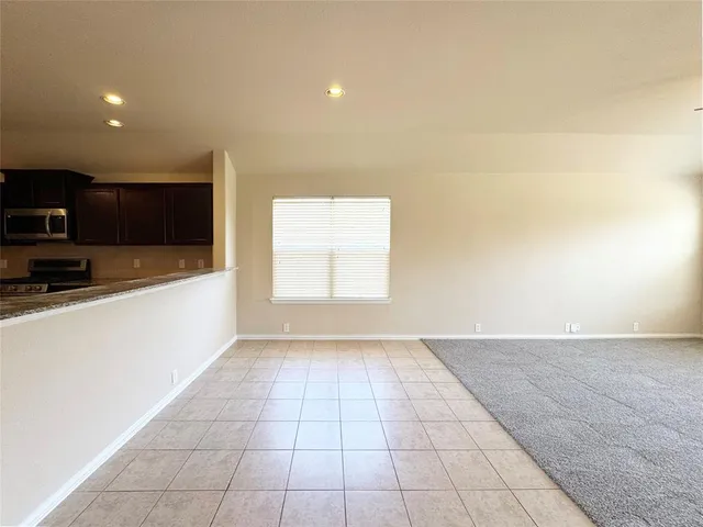 a view of a kitchen with a sink and a microwave