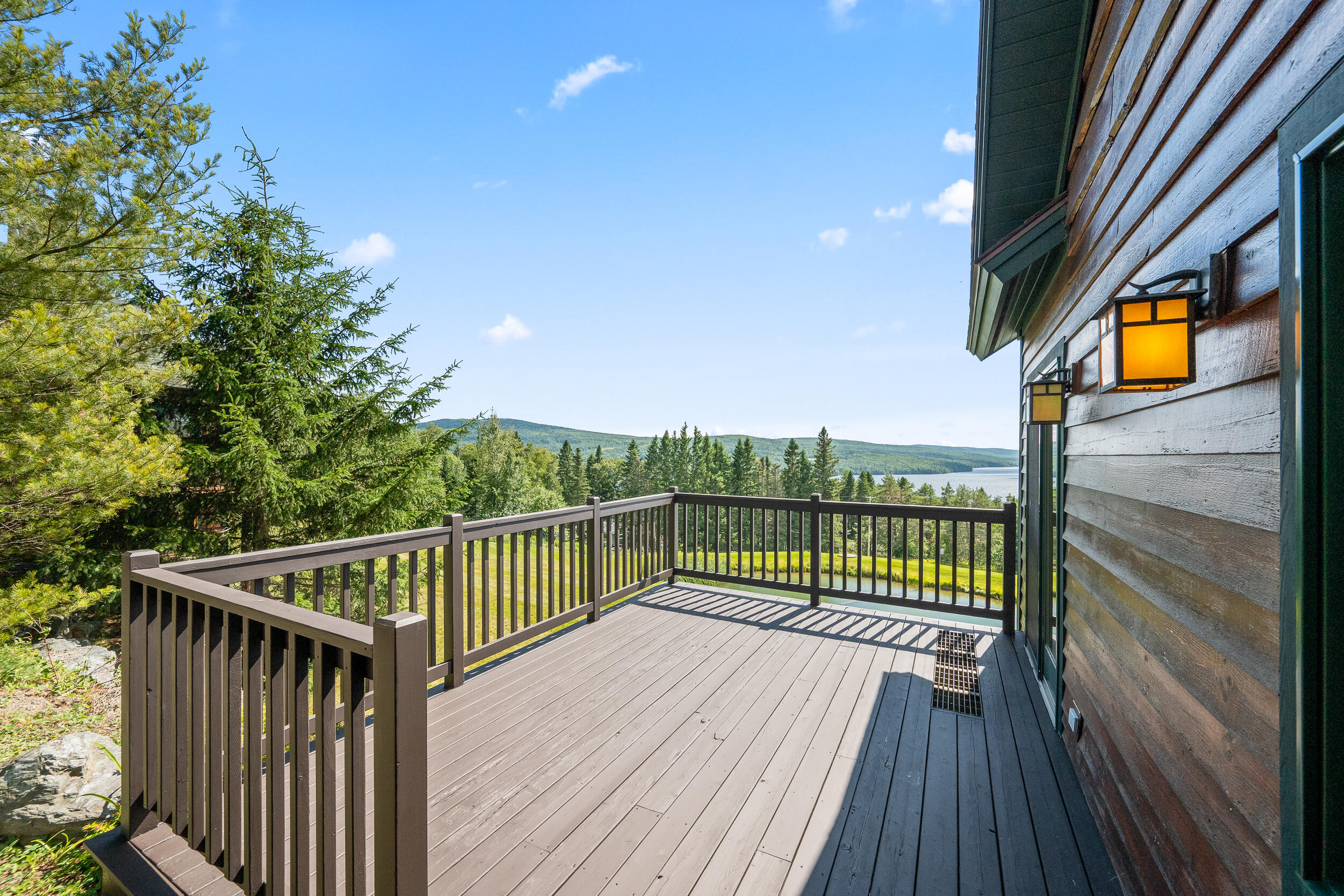 11 Whip Willow Farm Road, Unit 4 Rangeley, ME 04970 - Photo 2 of 35 Deck Overlooking the Lake