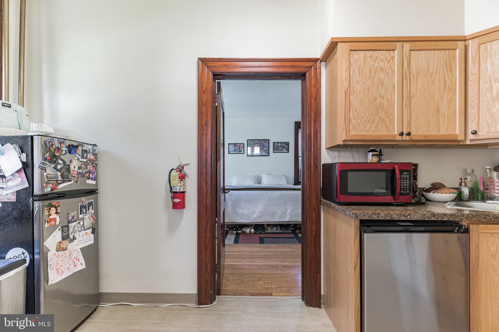 1320 Butler Pike, Unit 2 Conshohocken, PA 19428 - Photo 11 of 18 a kitchen with stainless steel appliances granite countertop a refrigerator and a stove