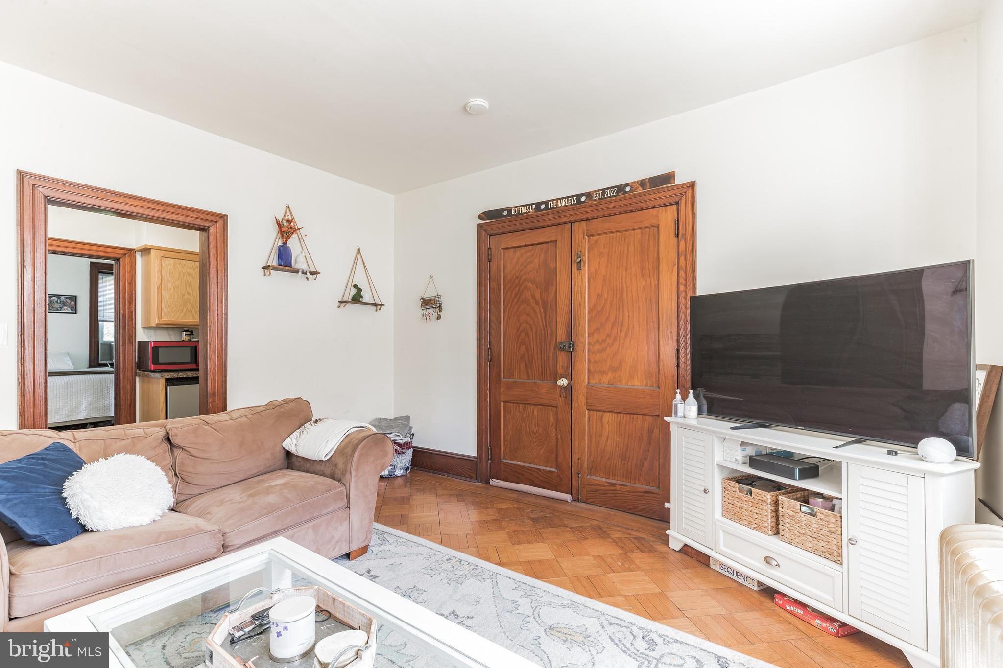 1320 Butler Pike, Unit 2 Conshohocken, PA 19428 - Photo 4 of 18 a living room with furniture and a flat screen tv