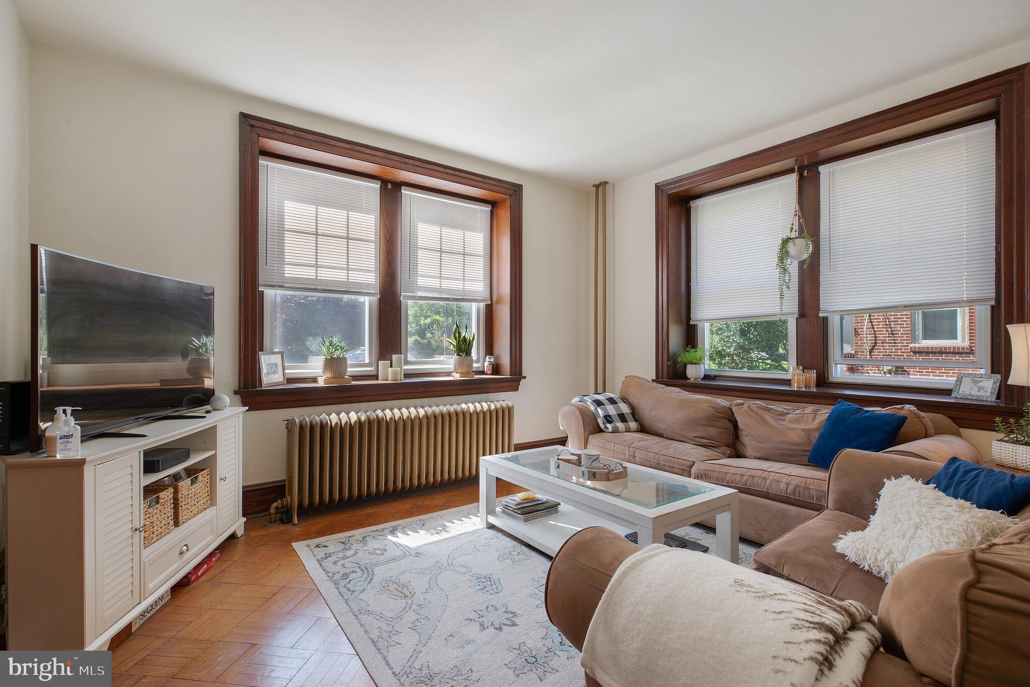 1320 Butler Pike, Unit 2 Conshohocken, PA 19428 - Photo 5 of 18 a living room with furniture and a flat screen tv