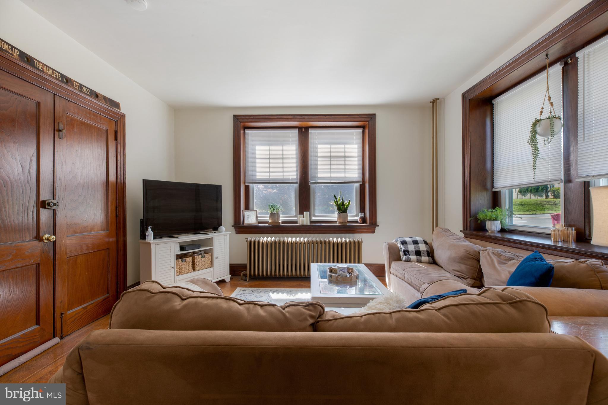 1320 Butler Pike, Unit 2 Conshohocken, PA 19428 - Photo 6 of 18 a living room with furniture and a flat screen tv