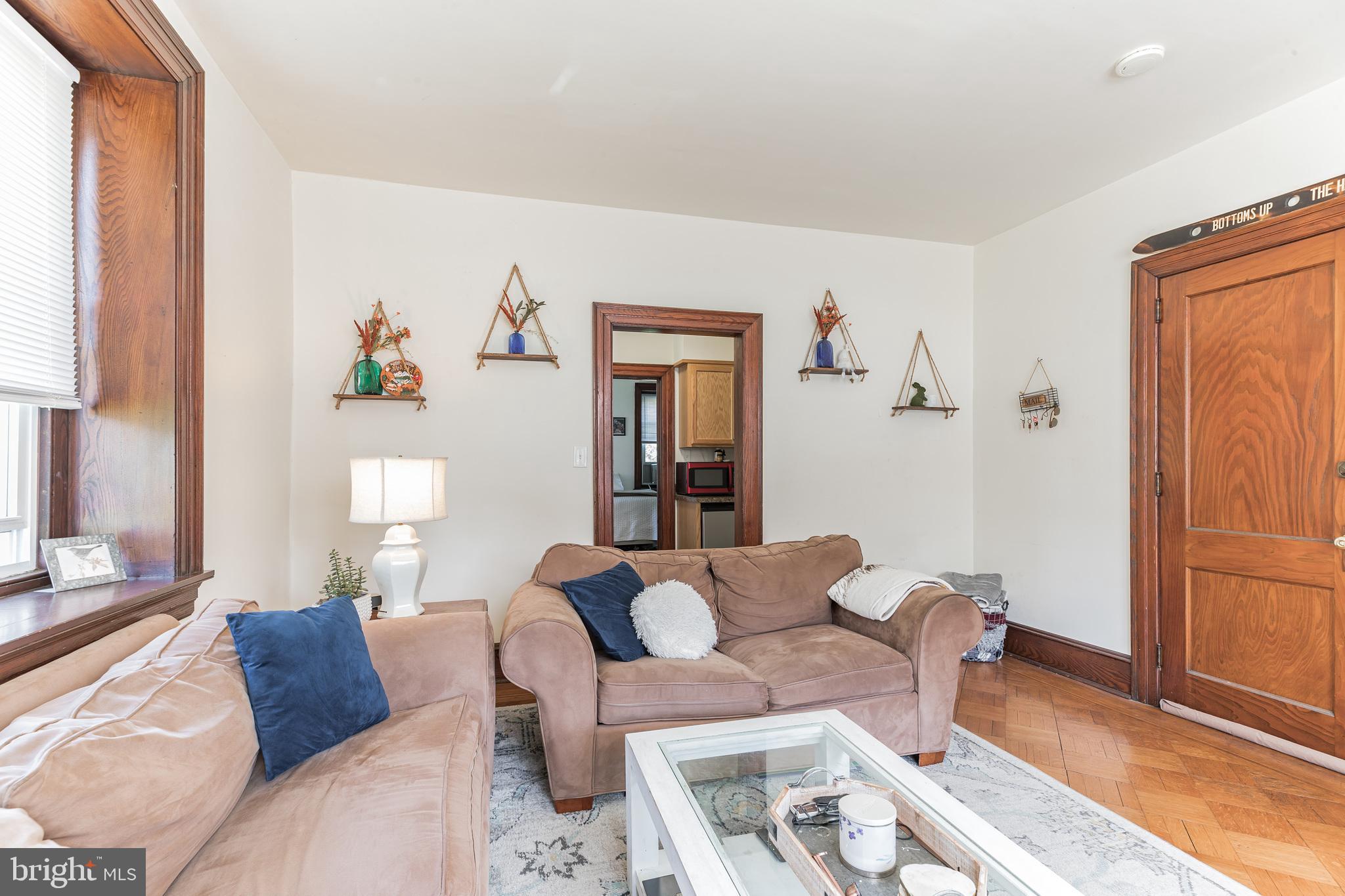 1320 Butler Pike, Unit 2 Conshohocken, PA 19428 - Photo 7 of 18 a living room with furniture and a window