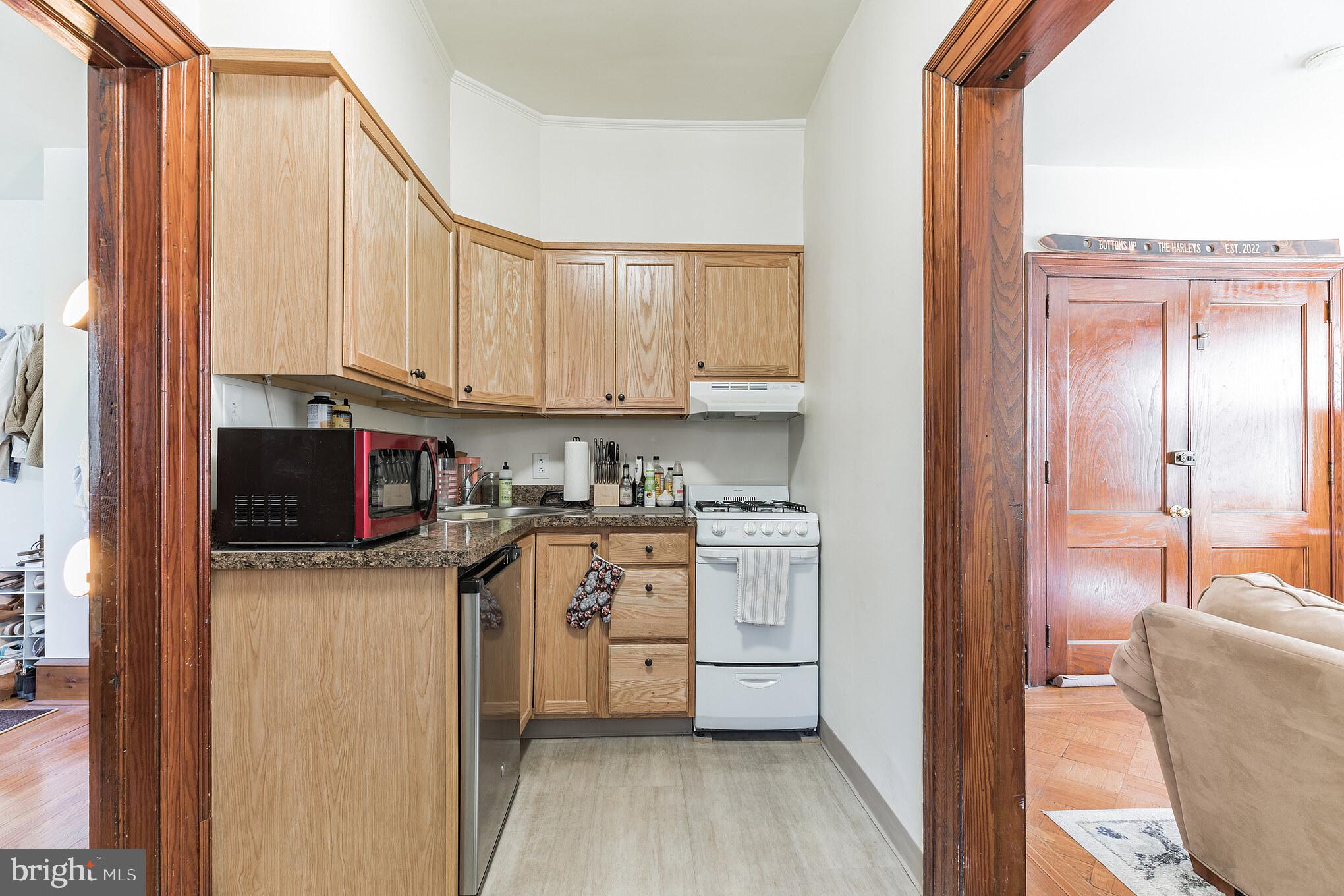 1320 Butler Pike, Unit 2 Conshohocken, PA 19428 - Photo 8 of 18 a kitchen with stainless steel appliances a stove top oven