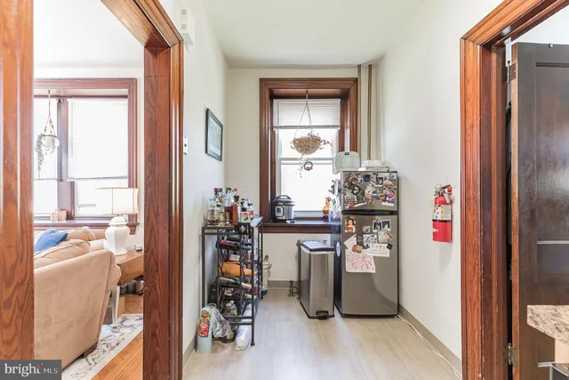 a kitchen with a refrigerator and a stove
