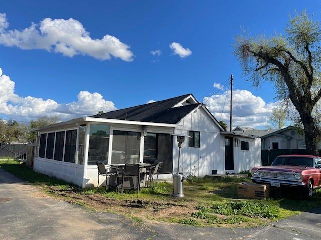 a front view of a house with garden and porch