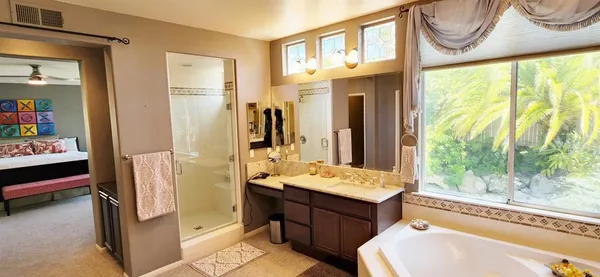 a bathroom with a sink a mirror and a bathtub