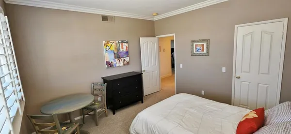 a bedroom with a bed and furniture