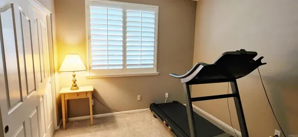 a room with window and furniture