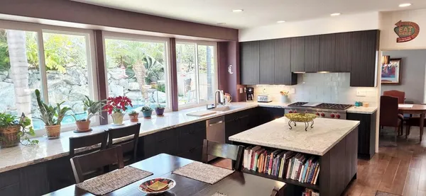 a kitchen with a table and chairs in it