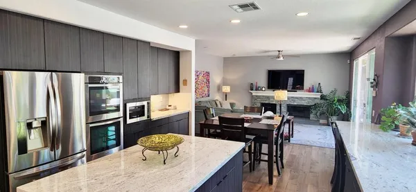 a dining room with furniture and a window