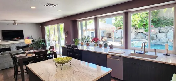 a kitchen with a table and chairs