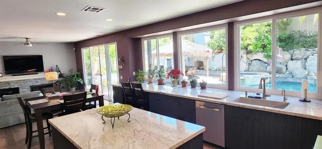 a kitchen with a table and chairs