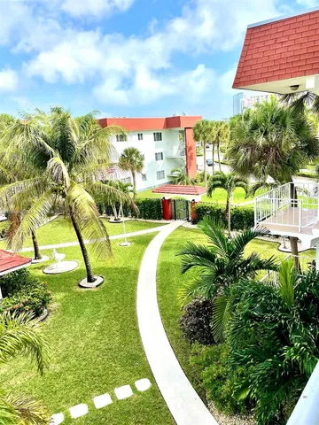 a view of a swimming pool with a yard