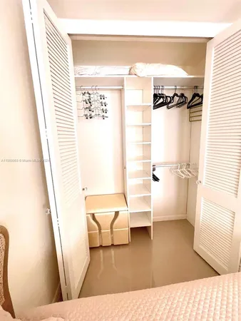 a view of an empty room and a window