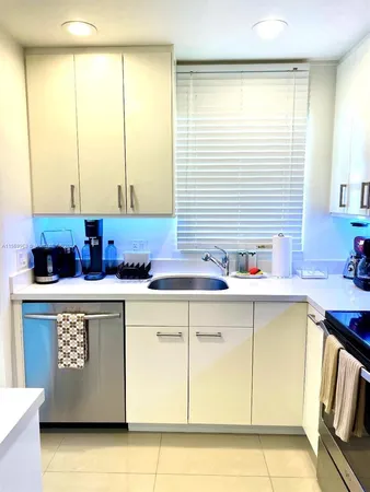 a kitchen with stainless steel appliances granite countertop a sink and a cabinets