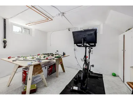 a utility room with cabinets dryer and washer