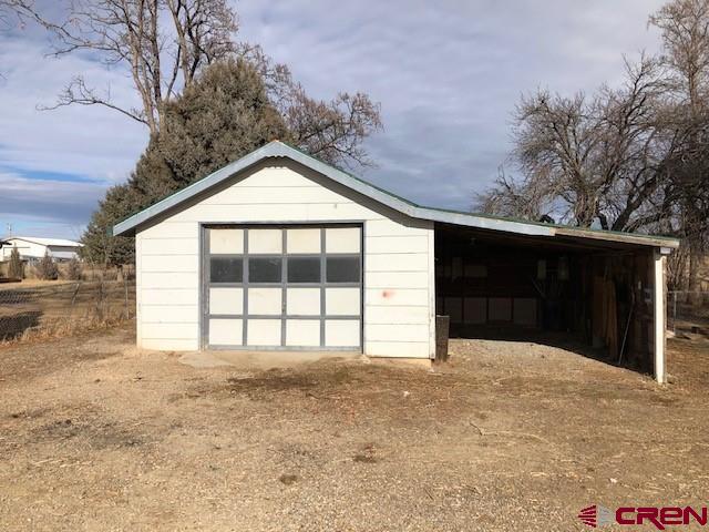 1862 9 Road Mack, CO 81525 - Photo 11 of 26 a view of wooden house with a yard
