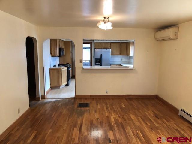 1862 9 Road Mack, CO 81525 - Photo 17 of 26 a view of a room with wooden floor and ceiling fan